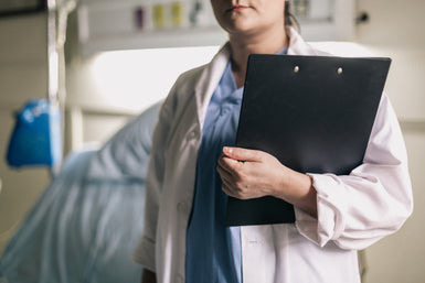 files/female-medical-professional-holds-clipboard-in-hospital-room.jpg